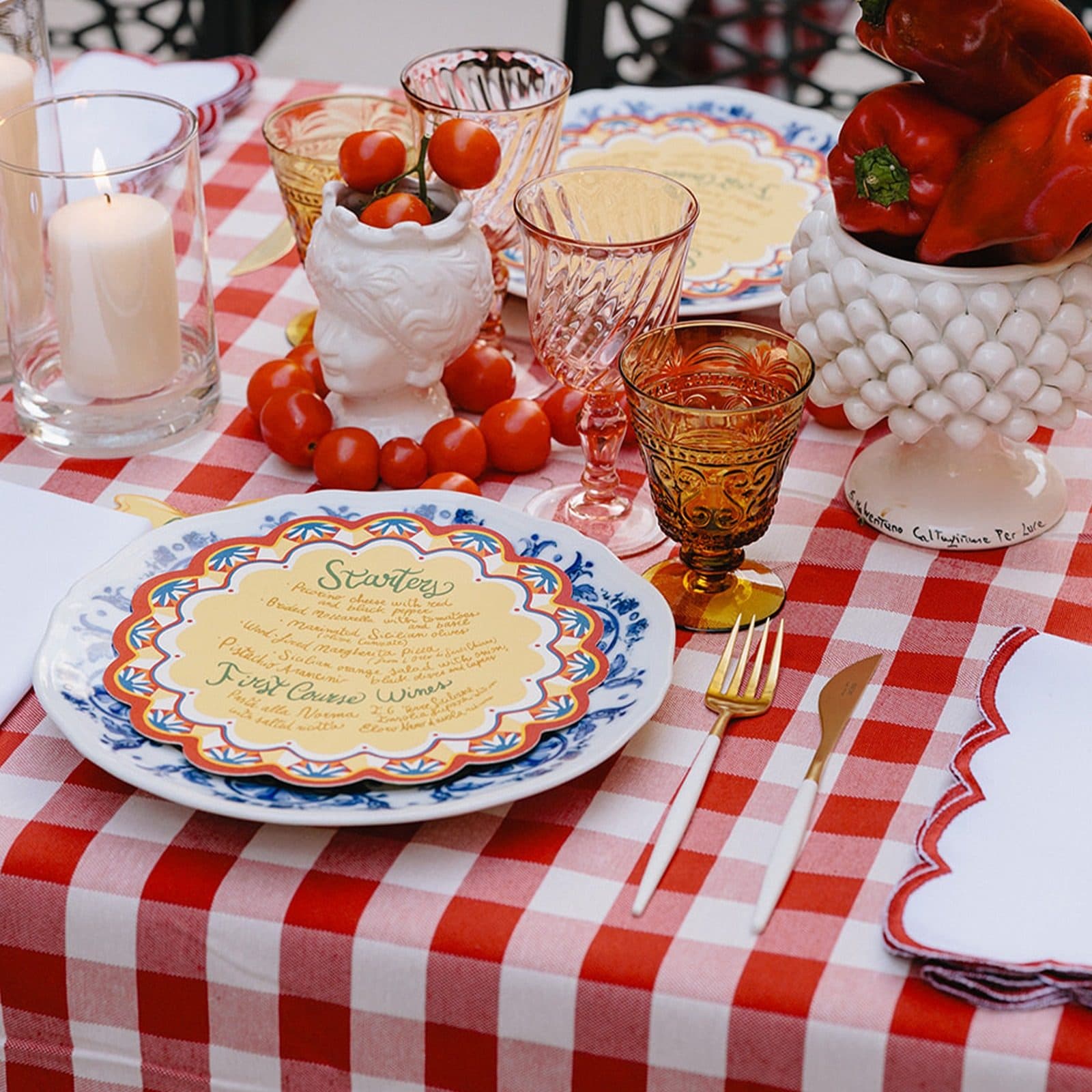 IuMi Studio colourful scalloped menu and coordinated textiles on a red gingham celebration table